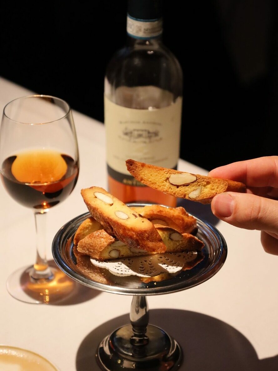 Almond cantucci served with a glass of Vin Santo, a traditional Tuscan dessert